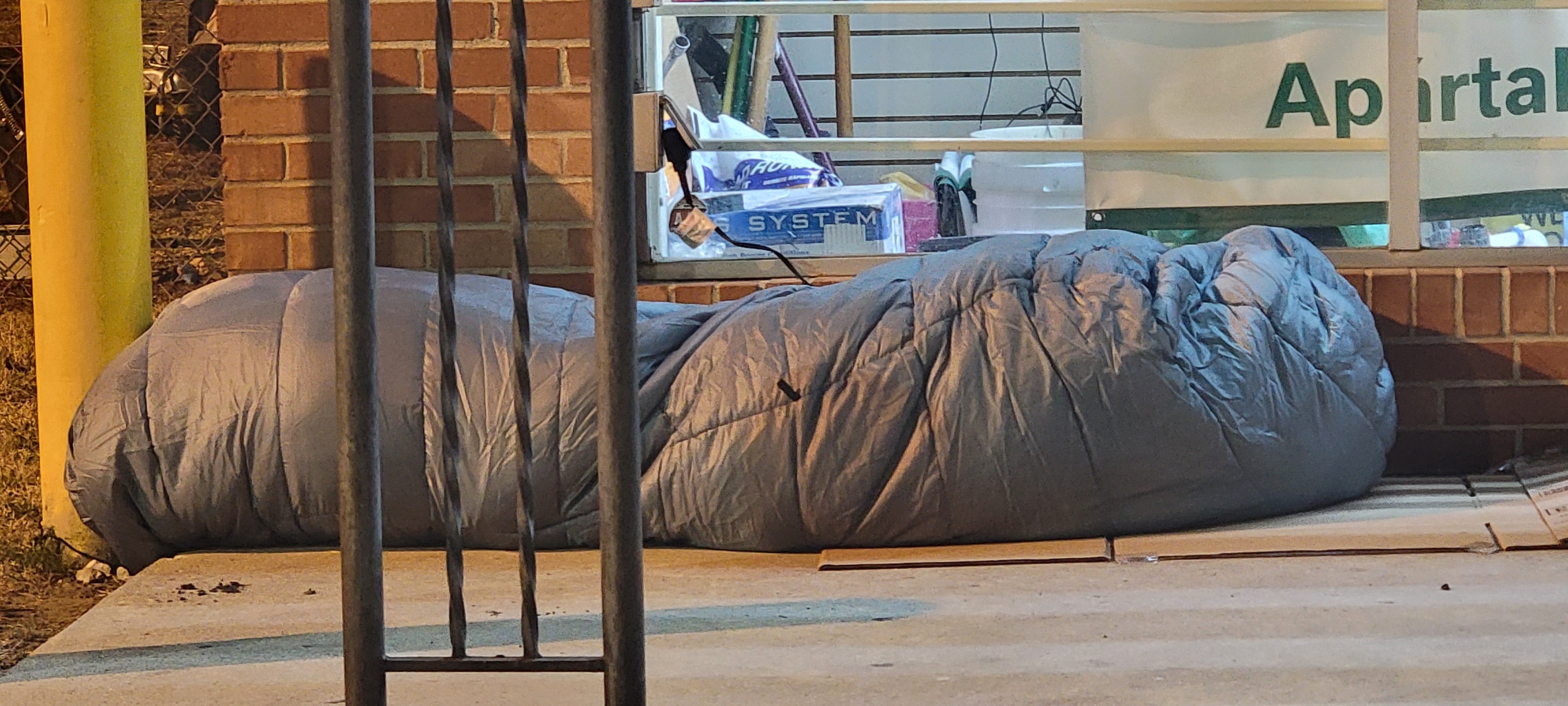 An individual walking in an urban community setting